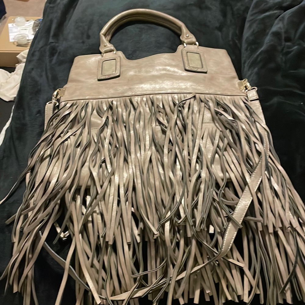 Aldo’s purse can be worn on shoulder or by hand